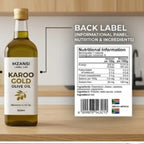 Bottle of Mzansi Karoo Gold olive oil with nutritional label on a kitchen counter.