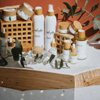 Skincare products with 'mi solo' branding on a wooden surface with green leaves. Labels and Print Solutions for Pro Small Batch Labels