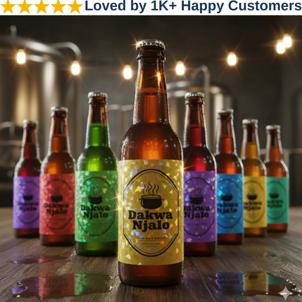 Bottles of Dakwa Njalo beer with colorful labels on a wooden table.