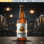 Beer bottle with 'Dakwa Njalo' label on a wooden surface with blurred background