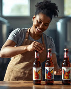 Woman in an apron standing behind three bottles of beer with colorful labels on a wooden surface.