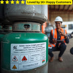 Green gas cylinder with safety label in a warehouse setting, worker in background