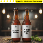 Two bottles of beer with labels 'Dakwa Njalo' and 'Phuza Nong IPA' on a wooden surface with a blurred background.